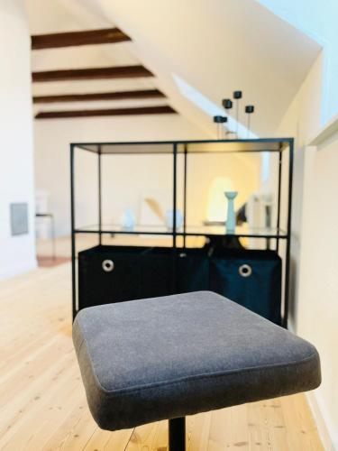 a glass case sitting on the floor in a room at Scandinavian Apartment Hotel - Lunden 1 - Central 3 bedroom apartment on two floors in Horsens