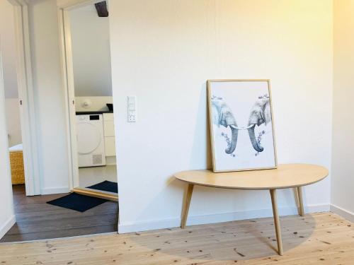 a picture of an elephant on a table in a room at Scandinavian Apartment Hotel - Lunden 1 - Central 3 bedroom apartment on two floors in Horsens