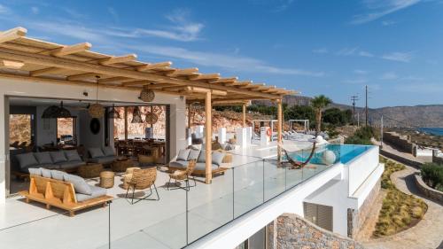 a villa with a view of the ocean at New Serenity Art Villa Elounda in Elounda