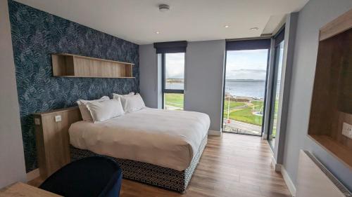 Postel nebo postele na pokoji v ubytování Shoreline Apartments