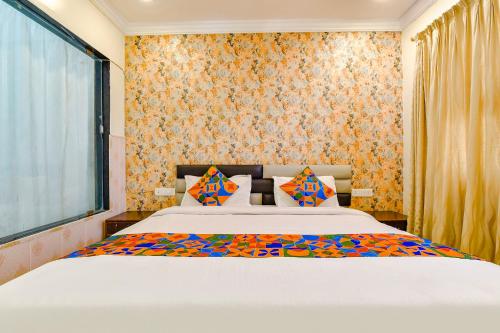 Postel nebo postele na pokoji v ubytování Hotel Golden Wings