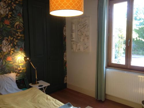 Ένα ή περισσότερα κρεβάτια σε δωμάτιο στο Le Fayard