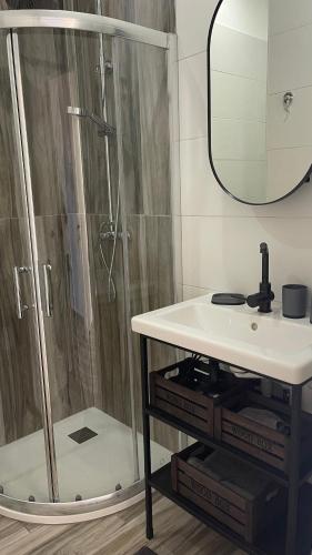 a bathroom with a shower and a sink at LAS MESAS HOUSE Ocean Escape in San Miguel de Abona