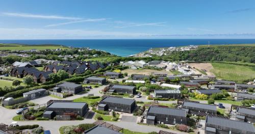 an aerial view of a village with the ocean at Gwel an Mor in Portreath