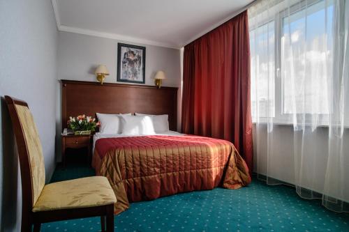 Кровать или кровати в номере Историческая Гостиница Калуга
