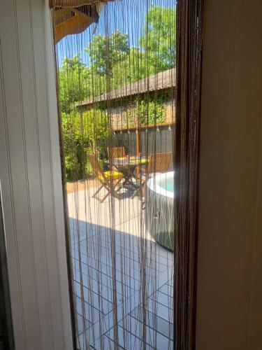 a sliding glass door with a view of a patio at The Yurt at Les Forges in Saint-Sornin-la-Marche