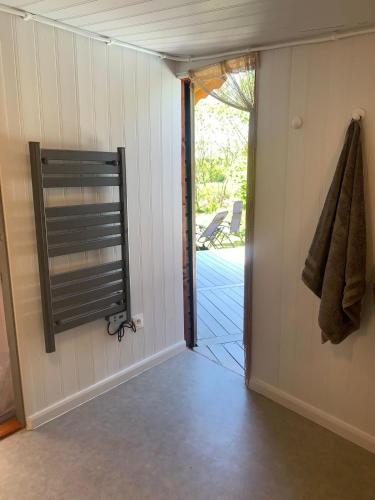 a room with a door leading to a patio at The Yurt at Les Forges in Saint-Sornin-la-Marche
