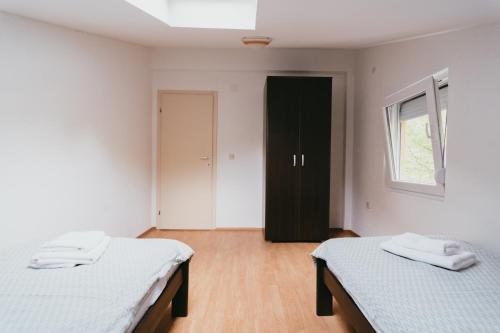 Postel nebo postele na pokoji v ubytování Villa Pandora
