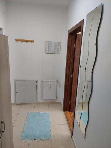 a mirror on a wall in a room at Smiley 2 - Subotica Centar in Subotica