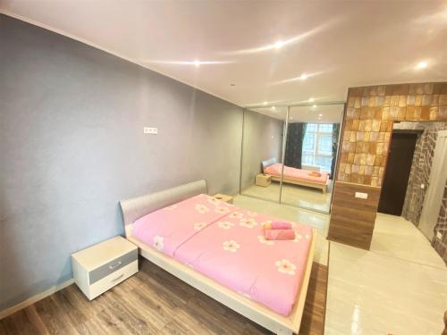 Katil atau katil-katil dalam bilik di Apartment on Raiduzhniy 58