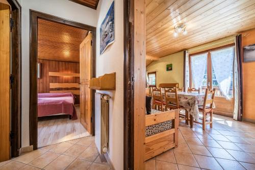 a room with a dining room and a bedroom at Apt Chénives 1 - Morzine in Morzine