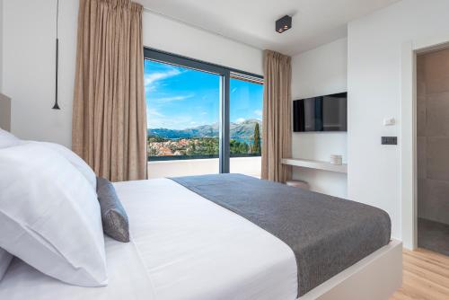 Ένα ή περισσότερα κρεβάτια σε δωμάτιο στο "Villa AnMari" The Cavtat View Residence