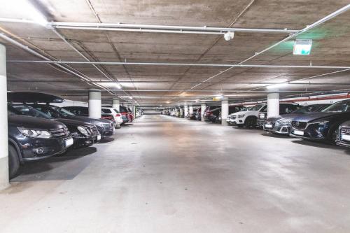 a parking garage filled with lots of parked cars at PLAZA Premium Timmendorfer Strand in Timmendorfer Strand