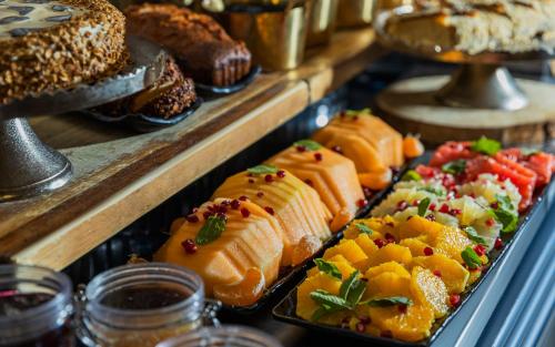 a display case filled with lots of different types of food at Horizon Red Sea in Eilat