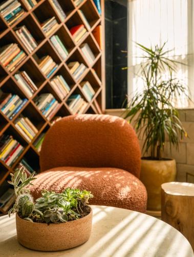 a chair sitting on a table in a library at Horizon Red Sea in Eilat