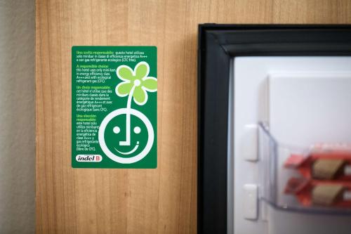 a green sign on a door with a clover on it at Best Western Plus Park Hotel Pordenone in Pordenone