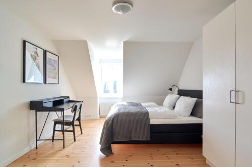 Postel nebo postele na pokoji v ubytování Lovely Flats by CPH Lakes in City Center
