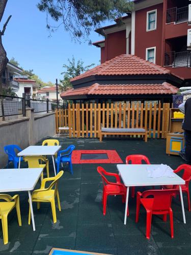 a group of tables and chairs with a gazebo at Grand Aquarium in Marmaris