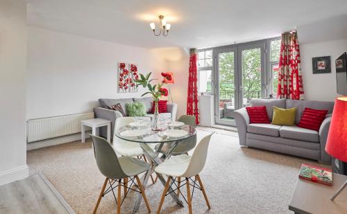 a living room with a table and chairs and a couch at Host & Stay - The Paddock in Bedlington