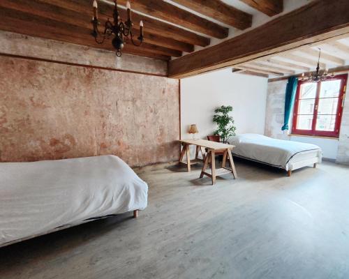 Posteľ alebo postele v izbe v ubytovaní Ancien hôtel particulier avec patio