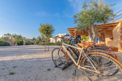 a bike parked in front of a house at Cava Li Santi Residence in Nardò