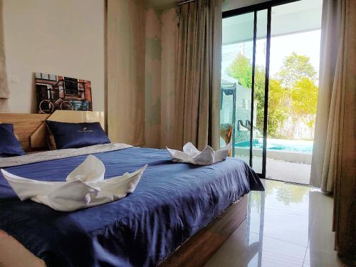 Postel nebo postele na pokoji v ubytování E villa , private pool villa for your family