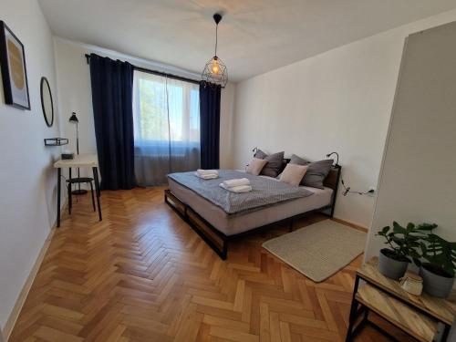 Postel nebo postele na pokoji v ubytování Pelclova Apartment