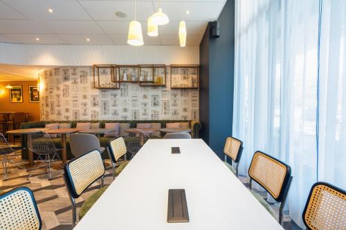 a conference room with a white table and chairs at Le Splendid Hotel Lac D'Annecy - Handwritten Collection in Annecy
