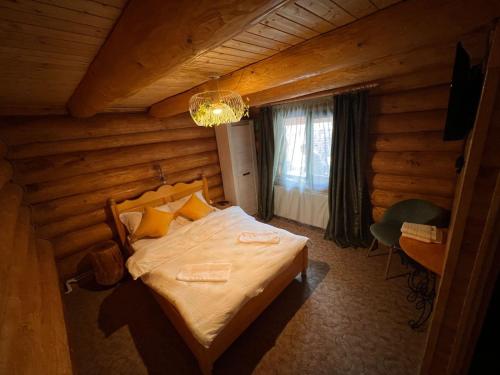 Postel nebo postele na pokoji v ubytování cabana 3 stejari