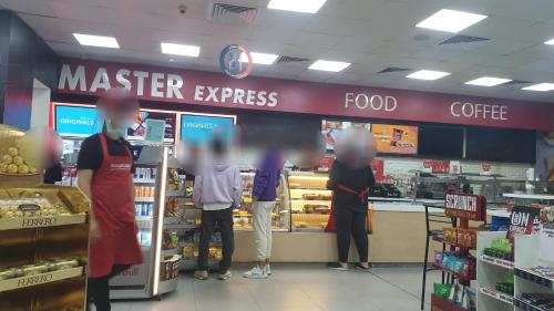 a group of people standing in a grocery store at Beautiful semi villa with private entrance in Sheikh Zayed- villa queen in Sheikh Zayed