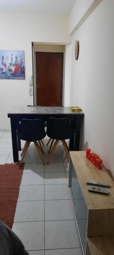 a table in a room with two chairs and a table at Departamento Macro in Mendoza