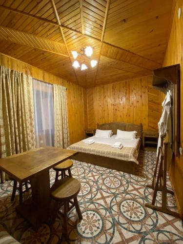 a bedroom with a bed and a desk in a room at Dachna Sadyba PB in Migovo