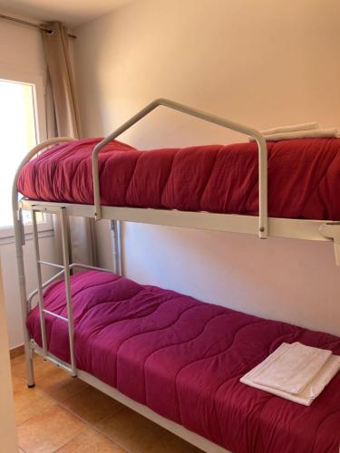 Poschodová posteľ alebo postele v izbe v ubytovaní Punta di mare, appartements bord de mer