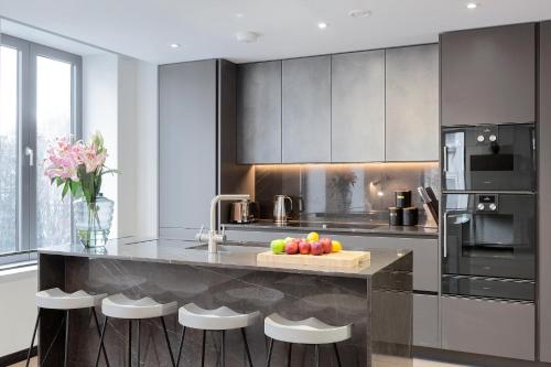 a kitchen with a counter with fruit on it at 37GS Residences in London