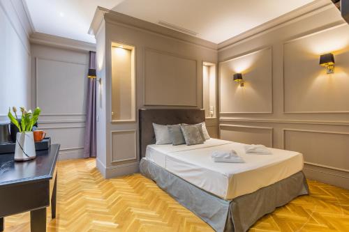 a hotel room with a bed and a desk at Belle Boutique in Sliema