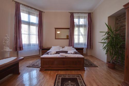 Ένα ή περισσότερα κρεβάτια σε δωμάτιο στο Csanabella House