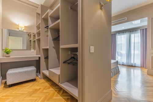 a walk in closet with a vanity and a mirror at Belle Boutique in Sliema