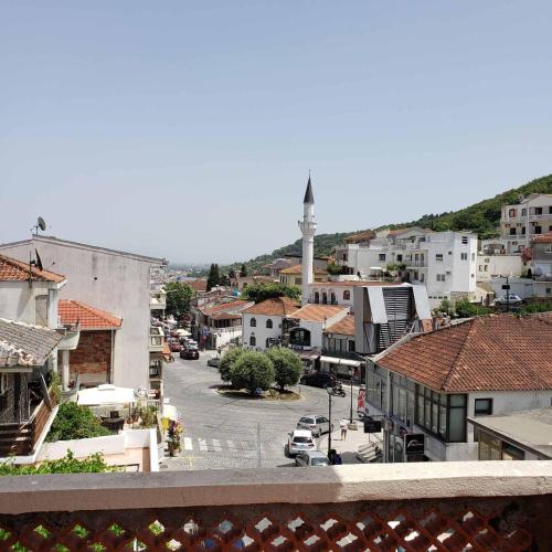 a view of a town with a street and a mosque at City Center Two-Bedroom Apartment in Ulcinj