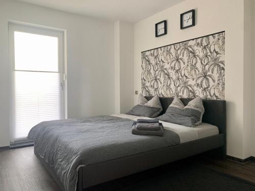 Un pat sau paturi într-o cameră la Appartement W@llstreet