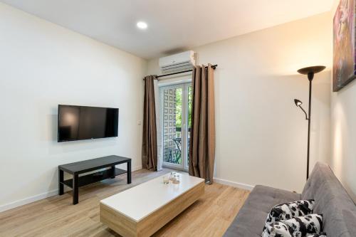 a living room with a couch and a table at Liberdade 546 Family Apartment By Sé Apartamentos in Braga