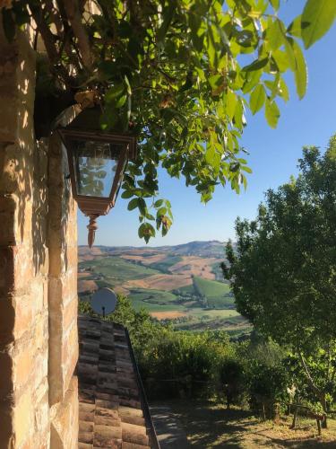 a light on the side of a building with a view at Effimera - Relaxing Retreat in Citta' Sant'Angelo