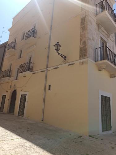 a white building with a light on the side of it at Casa cara al porto n. 26 in Bari