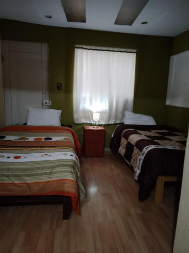 Katil atau katil-katil dalam bilik di Casa Salkantay Cusco