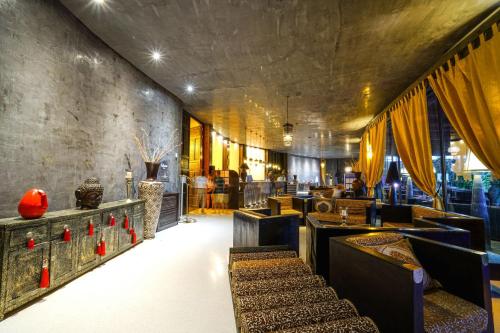 a restaurant with tables and chairs in a room at Amareclub Baia Dei Turchi Resort - Adults Only in Otranto