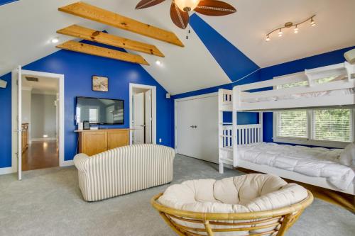 a bedroom with blue walls and a white bunk bed at Spacious Ocean City Home - Walk to Beach! in Ocean City