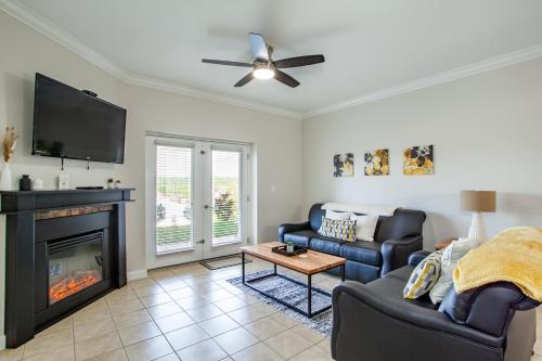 a living room with a couch and a fireplace at Mountain Retreat Condo View Community Amenities in Pigeon Forge