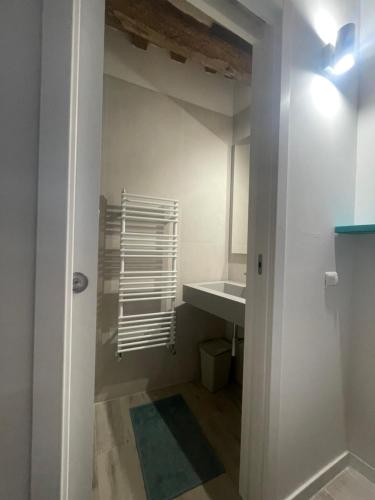 a bathroom with a sink and a mirror and a counter at L'Inferno di Dante in Gubbio