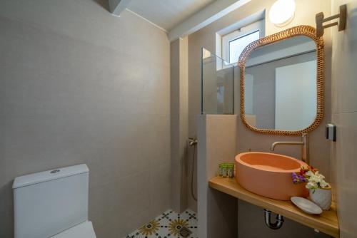 a bathroom with a sink and a mirror at Grand Bleu Anastazia in Porto Heli