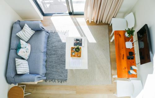 an overhead view of a living room with a blue couch at Cottage with a View in St Francis Bay