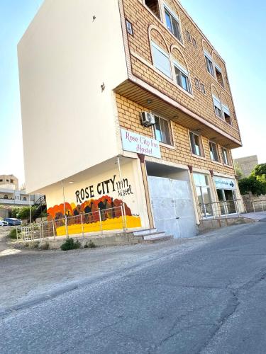 a building on the side of a street at Rose city inn in Wadi Musa
